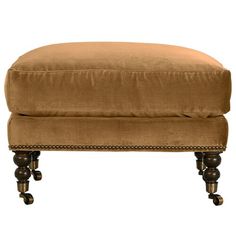 the foot stool is made from wood and has an upholstered cushion on it