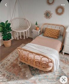 a bed sitting on top of a rug in a bedroom