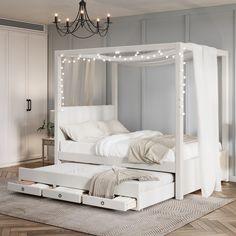 a white bed sitting on top of a hard wood floor next to a light fixture