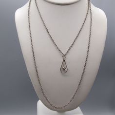 "Vintage Double Strand Chain Necklace with Crystal Teardrop Pendant, Silver Tone and Clear Sparkle Measurement * 15\" chain; 1\" x 1/2\" pendant Condition * Very nice condition. Gently used. Size: Womens 15\" Condition: Pre-Owned Good" Silver Teardrop Chain Necklace With Delicate Chain, Teardrop Pendant Necklace With Silver Chain, Silver Teardrop Pendant Chain Necklace, Antique Silver Teardrop Pendant Necklace, Antique Hallmarked Teardrop Jewelry, Nickel-free Metal Teardrop Necklace, White Teardrop Faceted Necklace, Vintage Hallmarked Teardrop Pendant Jewelry, Teardrop Pendant