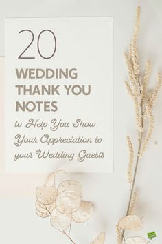 the wedding thank you notes have been placed next to some dried flowers on a table