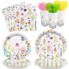 a set of four plates with flowers and butterflies on them, each decorated with different colored straws