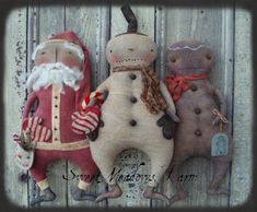 three handmade christmas dolls sitting next to each other on a wooden background with text overlay