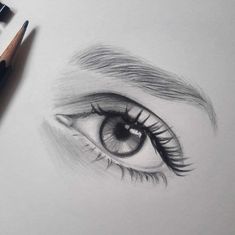 a pencil drawing of an eye with long lashes