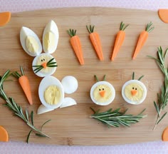 an image of some eggs with faces made out of carrots and other food items