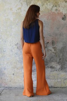 Designed to be your favorite for summer, these palazzo pants are just not the superstars in style but they're extremely comfy, too. Ethically handmade from organic gauze cotton fabric, these pants provide a sustainable solution for modern fashion. They're lightweight and breathing... What else can you ask for? We offer a variety of size options including plus, big and tall. Recommended Season: Summer & warm days of spring and fall. HOW TO STYLE THESE PANTS?Match these harem pants with our crop t Summer Full-length Harem Pants For Loungewear, Summer Cotton Bottoms In Orange, Orange Cotton Bottoms For Summer, Summer Orange Cotton Bottoms, Summer Cotton Straight Bottoms, Summer Cotton Wide-leg Harem Pants, Summer Wide Leg Cotton Pants Relaxed Fit, Cotton Wide Leg Pants With Relaxed Fit For Summer, Wide Leg Cotton Pants For Summer