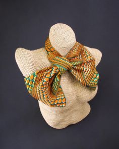 Introducing our African fabric neck scarf - a versatile and fashion-forward accessory that showcases cultural charm and allows you to express your unique style in multiple ways. Each scarf is handcrafted with authentic African fabric, featuring vibrant colors and patterns deeply rooted in African heritage. With meticulous attention to detail, we create each piece with care, ensuring a high-quality accessory that speaks to the richness of African artistry. Wear it as a neck scarf to elevate your Handmade Multicolor Scarves For The Beach, Handmade Multicolor Scarves For Beach, Handmade Multicolor Scarf For Beach, Traditional Handmade Multicolor Scarves, Multicolor Silk Scarf With Traditional Patterns, Multicolor Silk Shawl For Festival, Traditional Multicolor One-size Scarves, Traditional Multicolor Scarves One Size, Traditional Multicolor One Size Scarves