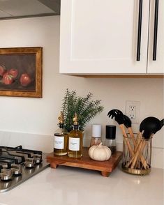 the kitchen counter is clean and ready to be used as cooking utensil holder