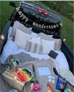 an open truck bed filled with food and drinks