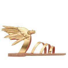 a pair of gold sandals with feathers on the toe and straps, all in different colors