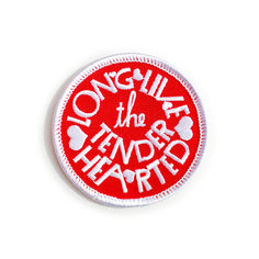 a red and white patch with words on it