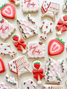 many decorated cookies are arranged on a table