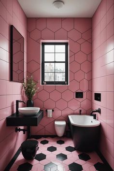 a black and white bathroom with pink tiles on the walls, two sinks and a bathtub