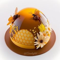 a cake with bees and flowers on it