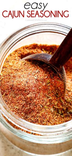 a jar filled with seasoning sitting on top of a table