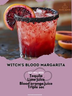 a blood margarita with orange slices on the rim