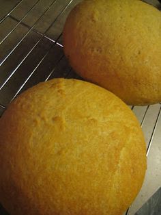 two loaves of bread cooling on a rack