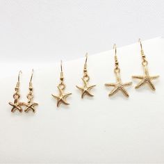 Earrings Starfish Beach Seashells Gold Tone Sea Shore Ocean Nautical Cruise Jewelry 3 Pack Handmade With Love By Me. No Flaws, No Returns. Gold Tone Charms On Hypoallergenic Earring Wires. [Earrings Starfish Beach Seashells Gold Tone Sea Shore Ocean Nautical Cruise Jewelry 3 Pack Minimalist Bohemian Summer Vacation Seaside] Starfish Jewelry For Vacation, Gold Nautical Jewelry For The Beach, Gold Nautical Jewelry For Beach, Nautical Style Gold Jewelry For The Beach, Gold Star Earrings For Summer, Star-shaped Summer Beach Jewelry, Gold Earrings For Beach Season, Beach Jewelry With Starfish Charm, Gold Starfish Jewelry For Vacation