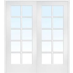 a white double door with glass panels