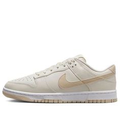 The Nike Dunk Low 'Light Bone Tan' is a stylish sneaker crafted from full-grain leather with a mesh tongue and lining. The Light Bone base is complemented by tan Swooshes, heel, tongue branding, insoles and rubber outsole. The white midsole and heel feature a white “NIKE” embroidered branding. This sneaker is perfect for everyday wear and is inspired by the classic Dunk series. The tan colorway adds a subtle touch of style to any outfit. With its timeless design, the Nike Dunk Low 'Light Bone Tan' is sure to be a hit. Beige Synthetic Sneakers With Contrast Sole, Sporty Beige Leather Skate Shoes, Classic Beige Sneakers For Streetwear, Beige Casual Skate Shoes For Streetwear, Comfortable Beige Low-top Sneakers, Casual Beige Skate Shoes For Streetwear, Nike Custom Sneakers With Gum Sole For Light Sports, Beige Nike Sneakers With Rubber Sole, Nike Lace-up Skate Shoes With Translucent Outsole