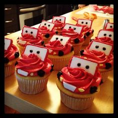 cupcakes with frosting are arranged on a table