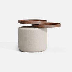 two wooden trays sitting on top of a white stool