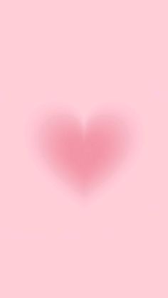 a heart shaped object on a pink background