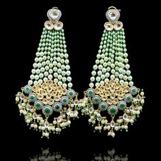 Leave an everlasting impression in these jhoomar earrings! Stunning earrings held together with emerald stones, kundan stones and pearl moti. Approximate earrings length is 4.25". Gold-plated on high-quality brass as base metal. Made by order. Kindly allow 4-6 weeks for the delivery of this item. For custom or urgent requests, please contact support@alacouture.com. *Please Note: We use faux stones and beads in all of our jewelry. Jhoomar Earrings, Faux Stone, Emerald Stone, Stunning Earrings, Base Metal, Emerald, Plating, Brass, Drop Earrings