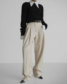 Classically tailored, high waisted pleated trousers in a luxe soft wool blend. - High waisted, straight wide leg- Long length- Front double pin tuck- Belt loops- Tab and zip closure- Side slit pockets- Small Waist 27", Length 44.5", Rise 13.5", Inseam 33.5"- Med Waist 29.5", Length 46", Rise 14", Inseam 33.5"- Tencel 65%, Rayon 25%, Wool 10%- Dry clean- Imported Relaxed Trousers, Pleated Trousers, Wool Trousers, Pleated Pants, Tailored Pants, Tailored Trousers, Soft Wool, Pin Tucks, Small Waist