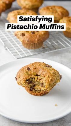 a muffin on a plate next to other muffins