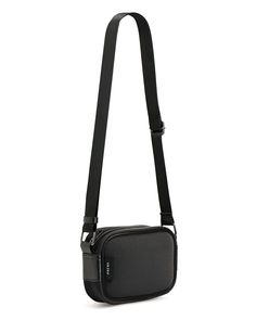 Key Features Black Smooth neoprene Internal zip pocket and open pocket Dark metallic hardware Adjustable strap Top zip closure Vegan friendly Fabrication 95% Neoprene, 5% Polyester. Size and Care (Approximate) Base Length: 16cm Top Length: 17cm Width: 6cm Height: 12cm Long Strap Length: 141cm Short Strap Length: 75cm Weight: 215g Machine wash on a cool gentle cycle with mild detergent. Remove any detachable accessories, such as baseboards or straps. We recommend placing the bag inside a mesh or Twist Weave, Neoprene Tote, Sleek Chic, Brighton Bags, Crossbody Bags For Travel, Bag Inside, Strap Top, Baseboards, Strap Tops