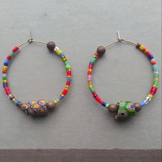 Pennyroyal | Jewelry | African Christmas Trade Bead Hoops | Poshmark Multicolor Wooden Beads Round Earrings, Multicolor Wooden Beaded Round Earrings, Multicolor Wooden Beaded Earrings, African Christmas, Red Heart Earrings, Witch Earrings, Gold Chandelier Earrings, Blue Charm, Black Earrings Dangle