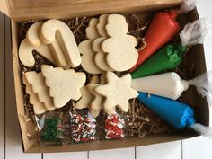 an open box filled with cookies and candy