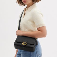 The Soft Tabby reimagines our structured take on an archival 1970s Coach design with a slouchy relaxed feel. Finished with our Signature hardware for an iconic touch this smooth leather shoulder bag features zip pockets inside and out to organize small accessories and two detachable straps to carry by hand style as a short shoulder bag or wear crossbody. | Coach Soft Tabby Shoulder Bag - Women's - Brass/black Coach Soft Tabby Outfit, Coach Soft Tabby Shoulder Bag, Coach Soft Tabby, Soft Tabby Shoulder Bag, Tas Coach, Tabby Shoulder Bag, Crossbody Coach, Hand Style, Casual Evening