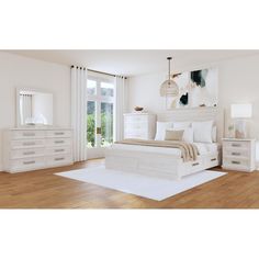 a bedroom with white furniture and wood floors