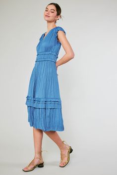 Allover pleating, fluttery cap sleeves, and sweet ruffle accents deliver a decidedly feminine look to this V-neck midi dress in a classic blue hue. A go-to for date night or daily wear easily paired with any second layer of your choosing.On Average, customers say this style runs large SMALL BODY LENGTH - 46" •Irregular pleating •V-neck •Cap sleeves •Allover pleating •Ruffle trim •Midi length Item number: 1790162100% Polyester Hand Wash Cold V Neck Midi Dress, Pleated Midi Dress, Feminine Look, Trending Dresses, Shades Of Black, Classic Blue, Blue Hues, Ruffle Trim, Item Number