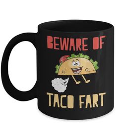 a black coffee mug that says beware of taco fart