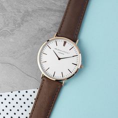 With its sleek modern design complemented by timeless accents, the Mr Beaumont watch is the epitome of sophistication. Featuring a generously sized 41mm dial adorned with metallic silver details, this timepiece exudes elegance. Crafted from genuine leather, the strap adds a luxurious touch to the watch, ensuring both style and comfort. Elevate this exceptional gift by personalising the reverse of the watch with a heartfelt message of up to five lines. Presented in Mr Beaumont's signature gift box and accompanied by a leather watch protector, this exquisite timepiece is ready to impress from the moment it's unwrapped. Whether for a special occasion or as a token of appreciation, the Mr Beaumont watch is a gift that will be cherished for years to come. BATTERY WARNING: KEEP OUT OF REACH OF C Brown Leather Watch Men, Brown Leather Watch, Mens Watches Leather, Personalised Gifts For Him, Brown Leather Strap, Luxury Gift Box, The Ultimate Gift, Personalized Leather, Vintage Brown