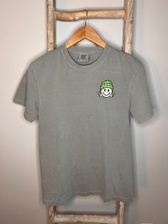 St. Patrick's Day Embroidered Tee Comfort Color brand; Gray shirt Fits true to size; order one size up for oversized fit  Garment details: -100% ring spun cotton -Garment-dyed soft ring spun fabric -Relaxed fit -Topstitched, classic width, rib collar Peace Sign Embroidery, Smiley Embroidery, Ellie Ellie, Garment Details, Yellow Springs, Embroidered Tee, Gray Shirt, Soft Ring, Saint Patrick