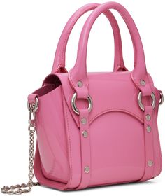 Structured patent leather top handle bag in pink. · Studs, O-rings, and D-rings throughout · Twin rolled carry handles · Detachable chain crossbody strap · Logo hardware at foldover flap · Bumper studs at base · Magnetic press-stud closure · Card slot at interior · Silver-tone hardware · H6 x W6.5 x D3.5 Supplier color: Pink Pink Top Handle Satchel With Silver-tone Hardware, Pink Satchel With Silver-tone Hardware, Modern Pink Shoulder Bag With Chain Strap, Pink Rectangular Bag With Metal Hardware, Pink Satchel With Silver-tone Hardware And Double Handle, Pink Top Handle Shoulder Bag With Metal Hardware, Modern Pink Shoulder Bag With Metal Hardware, Pink Shoulder Bag With Metal Hardware For Shopping, Pink Top Handle Bag With Metal Hardware