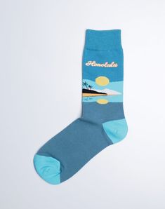 Get ready to soak up the island vibes with our Honolulu Reflection Crew Socks from Just Fun Socks! These stunning blue socks are sure to transport you straight to the tropical paradise of Honolulu, with a gorgeous image of a lush island and its reflection in the crystal-clear waters. If you love to vacation in Honolulu, take your feet on a vacation everyday by adding our Honolulu Reflection Crew Sock to your sock drawer. Exclusively from the Just Fun Socks Hawaii Island Collection. Mahalo. Featu Comfortable Blue Summer Socks, Comfortable Blue Socks For Summer, Fun Socks, Sock Drawer, Blue Socks, Crew Sock, Island Vibes, Hawaii Island, Tropical Paradise