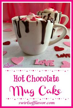 hot chocolate mug cake in a white cup with pink and red hearts on the table