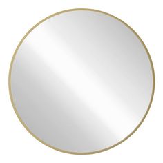 a round mirror on a white background with gold trimmings and a circular shape