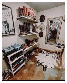 a room with some shoes on shelves and a rug in the floor next to it