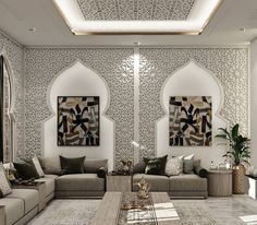 a living room with couches, tables and pictures on the wall behind them in arabic style