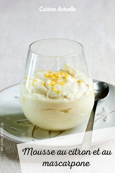 a dessert in a glass on top of a white plate