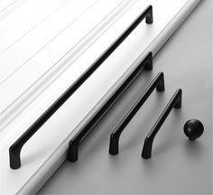 an assortment of black and white door handles