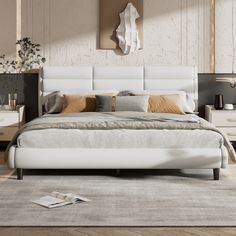 a white bed sitting on top of a wooden floor