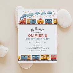 a birthday party card with a train theme on the front and an envelope that says, all aboard to celebrate ollivier's 3rd birthday party