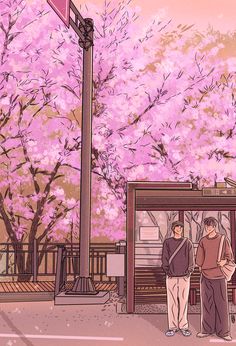 two people standing in front of a bus stop with pink flowers on the trees behind them